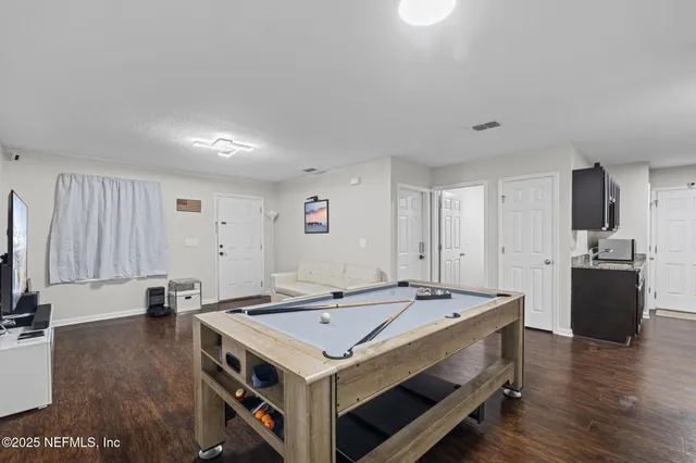 a bed room with furniture and a table