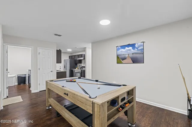 a kitchen with a stove and a refrigerator