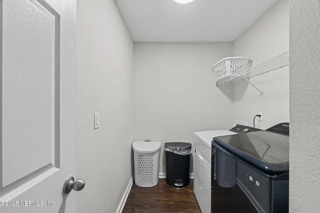 a view of a room that has a table and chairs in it