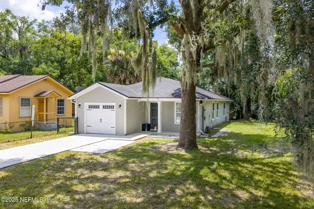 front view of a house with a yard