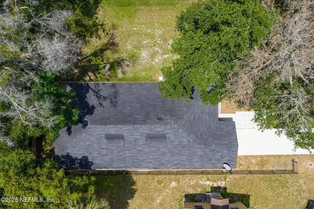 a big house with trees in the background