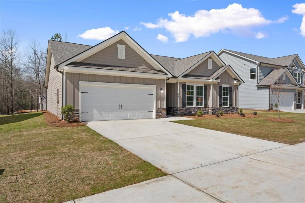 526 Lillian Way Statham, GA 30666 - Photo 2 of 56 a front view of a house with a yard