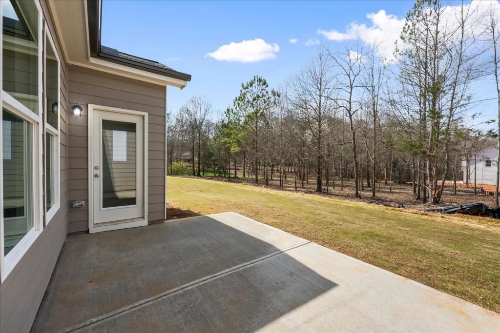 526 Lillian Way Statham, GA 30666 - Photo 27 of 56 a view of a house with a yard