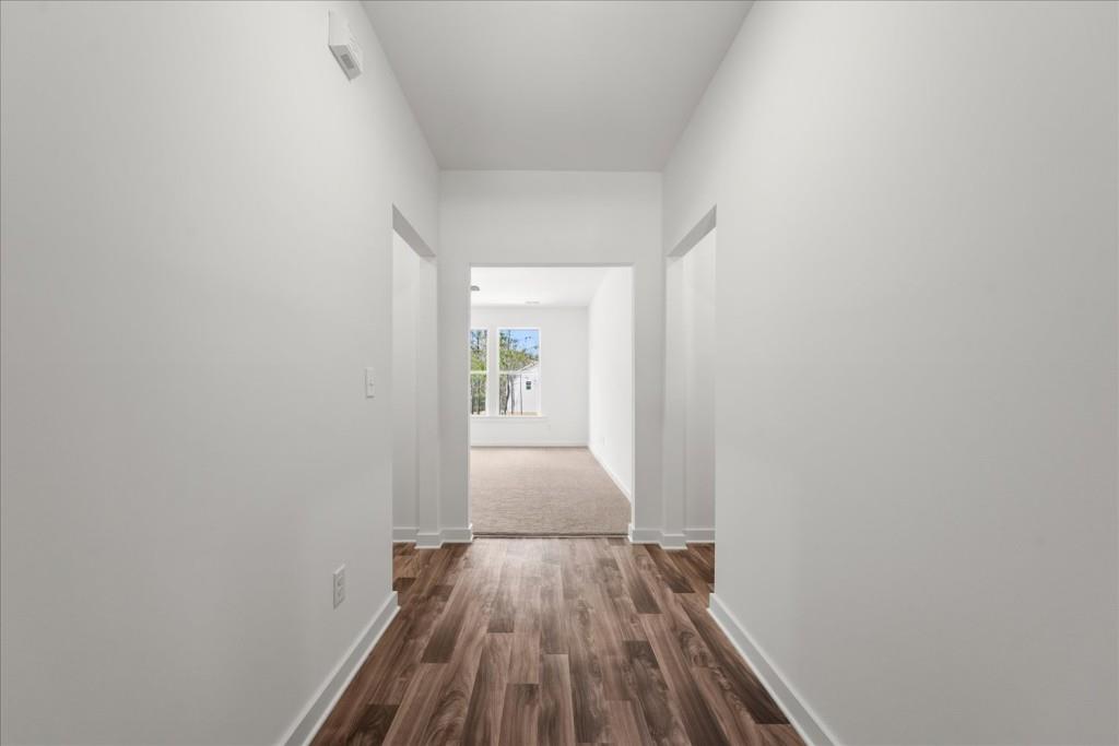 526 Lillian Way Statham, GA 30666 - Photo 3 of 56 a view of a hallway with wooden floor