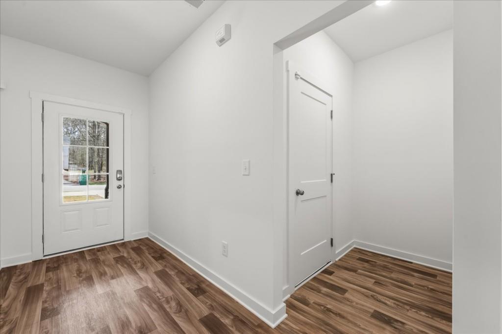 526 Lillian Way Statham, GA 30666 - Photo 4 of 56 a view of a room with wooden floor and a window