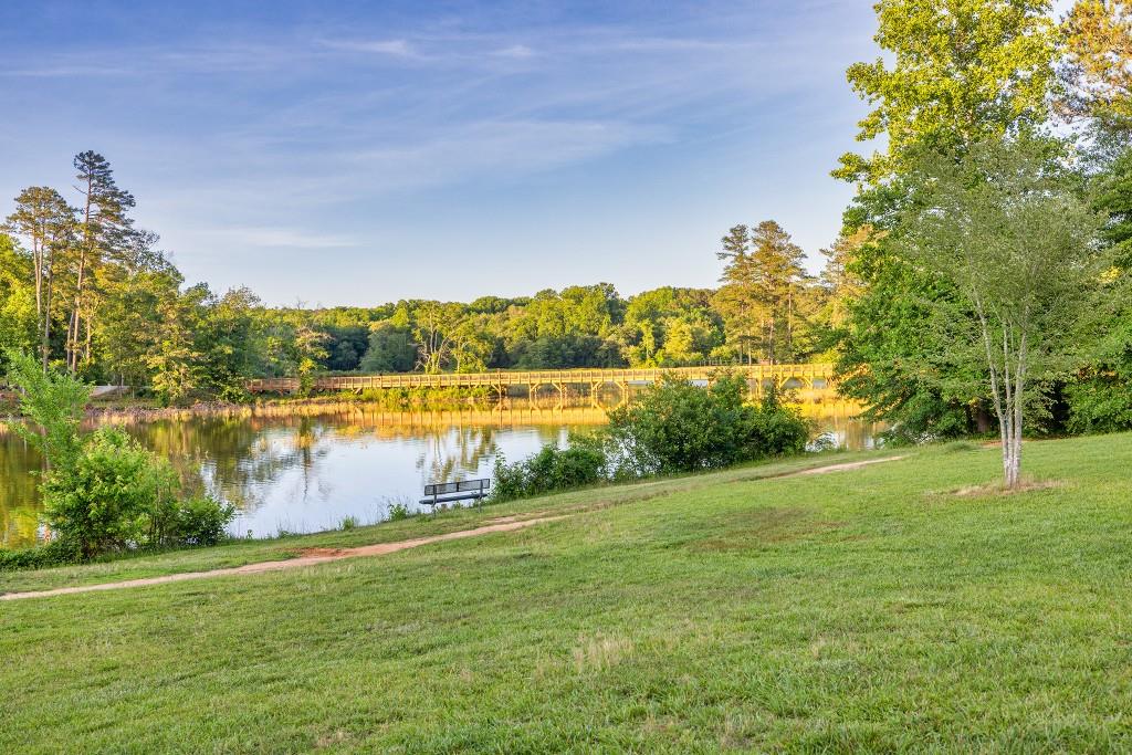 526 Lillian Way Statham, GA 30666 - Photo 43 of 56 a view of a lake with houses in the back