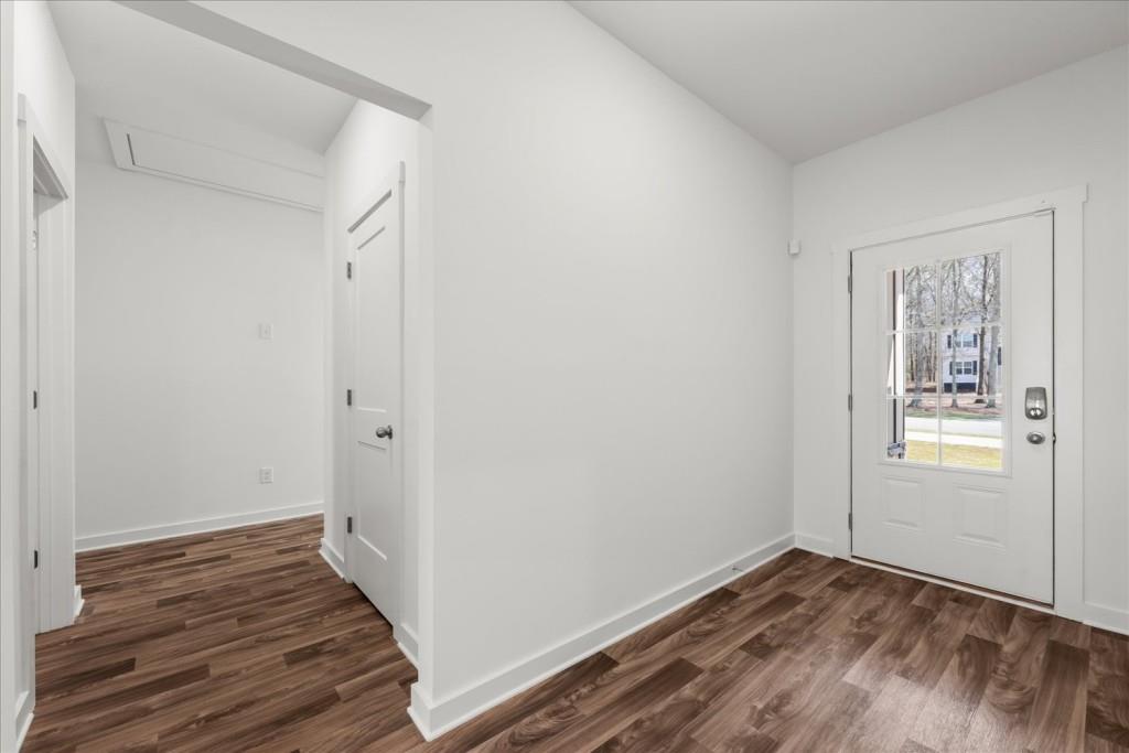 526 Lillian Way Statham, GA 30666 - Photo 5 of 56 a view of a room with wooden floor and cabinet
