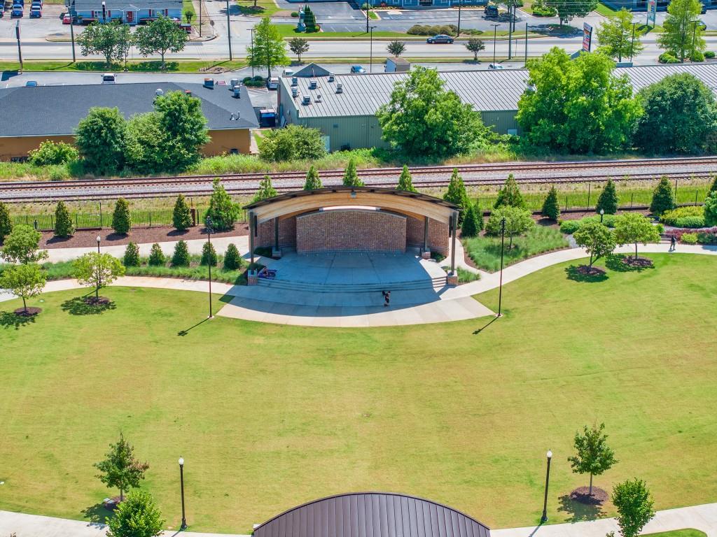 526 Lillian Way Statham, GA 30666 - Photo 52 of 56 a view of a swimming pool with lawn chairs and plants
