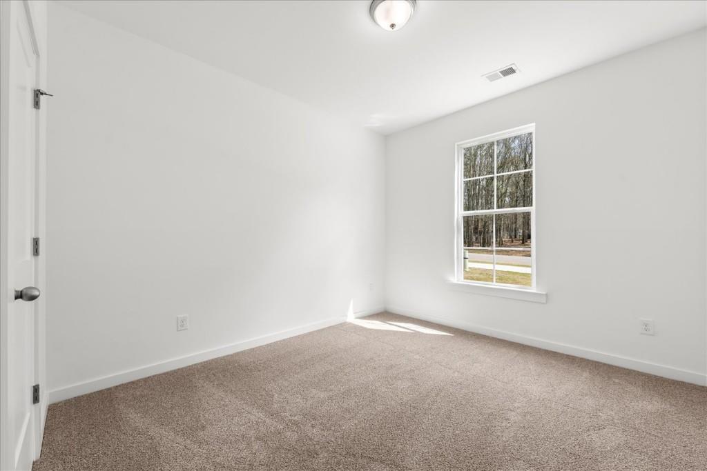 526 Lillian Way Statham, GA 30666 - Photo 9 of 56 an empty room with a window