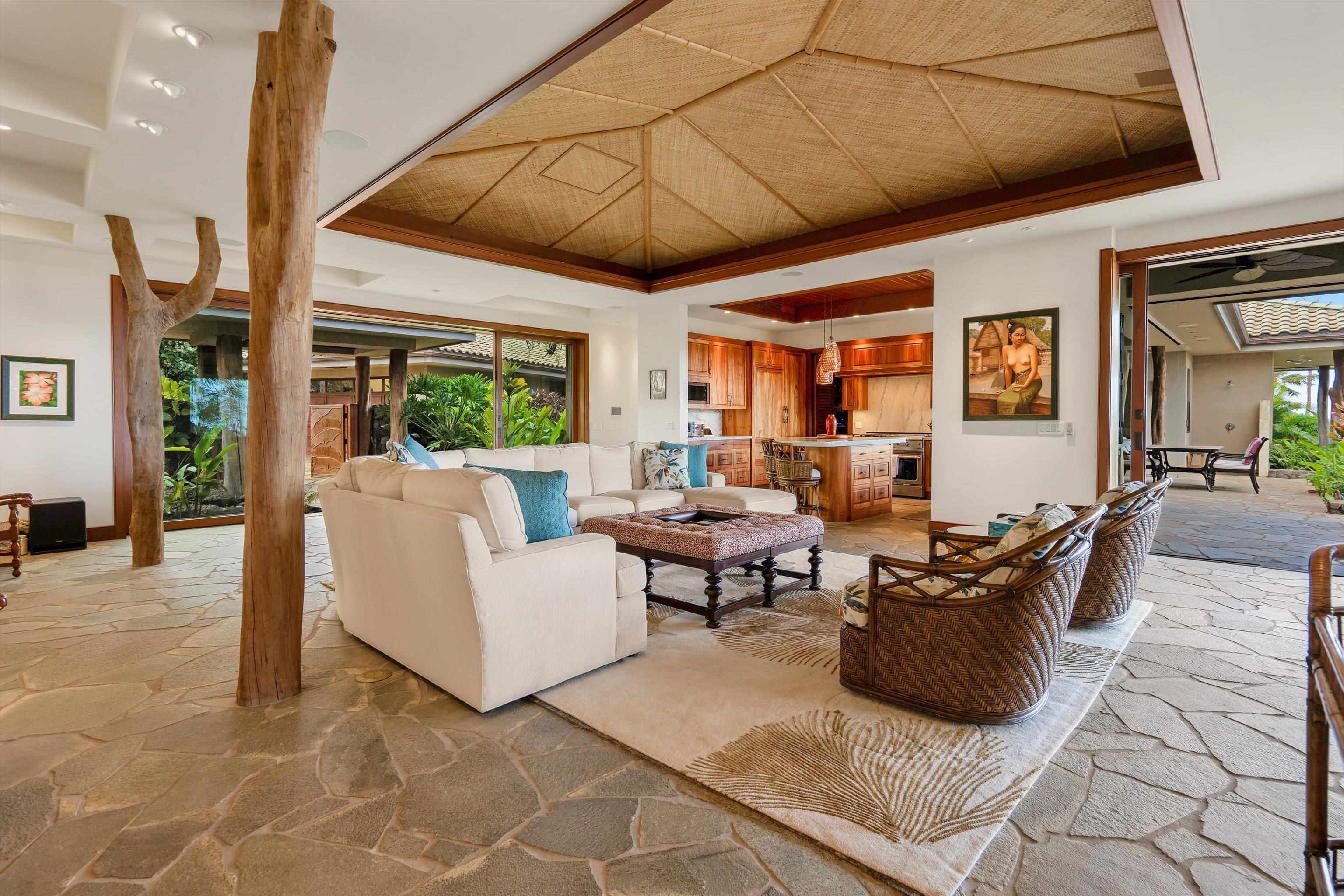 137 Anapuni Loop Lahaina, HI 96761 - Photo 16 of 47 a living room with furniture a wooden floor and next to a window