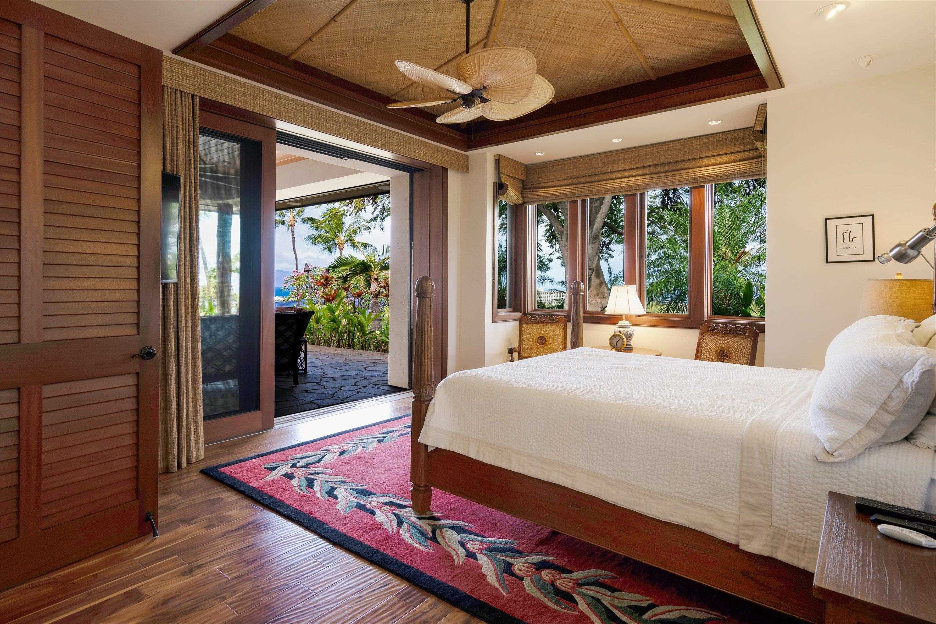 137 Anapuni Loop Lahaina, HI 96761 - Photo 19 of 47 a bed room with a bed and a large window