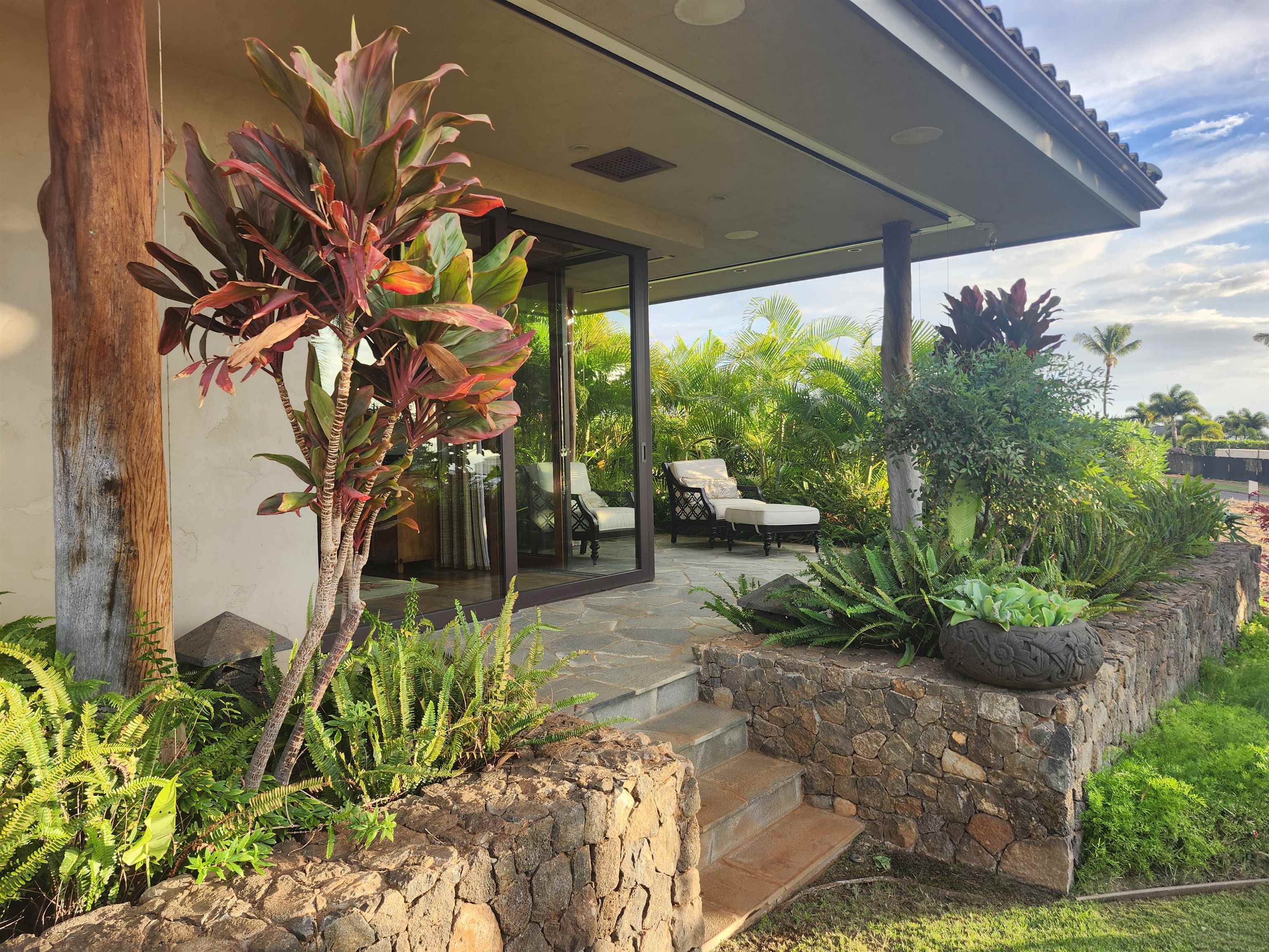 137 Anapuni Loop Lahaina, HI 96761 - Photo 26 of 47 a view of a patio with table and chairs potted plants