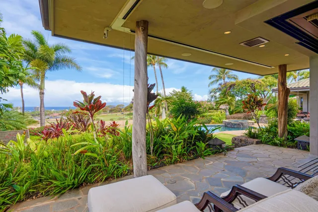 a spacious bathroom with a granite countertop tub sink and mirror