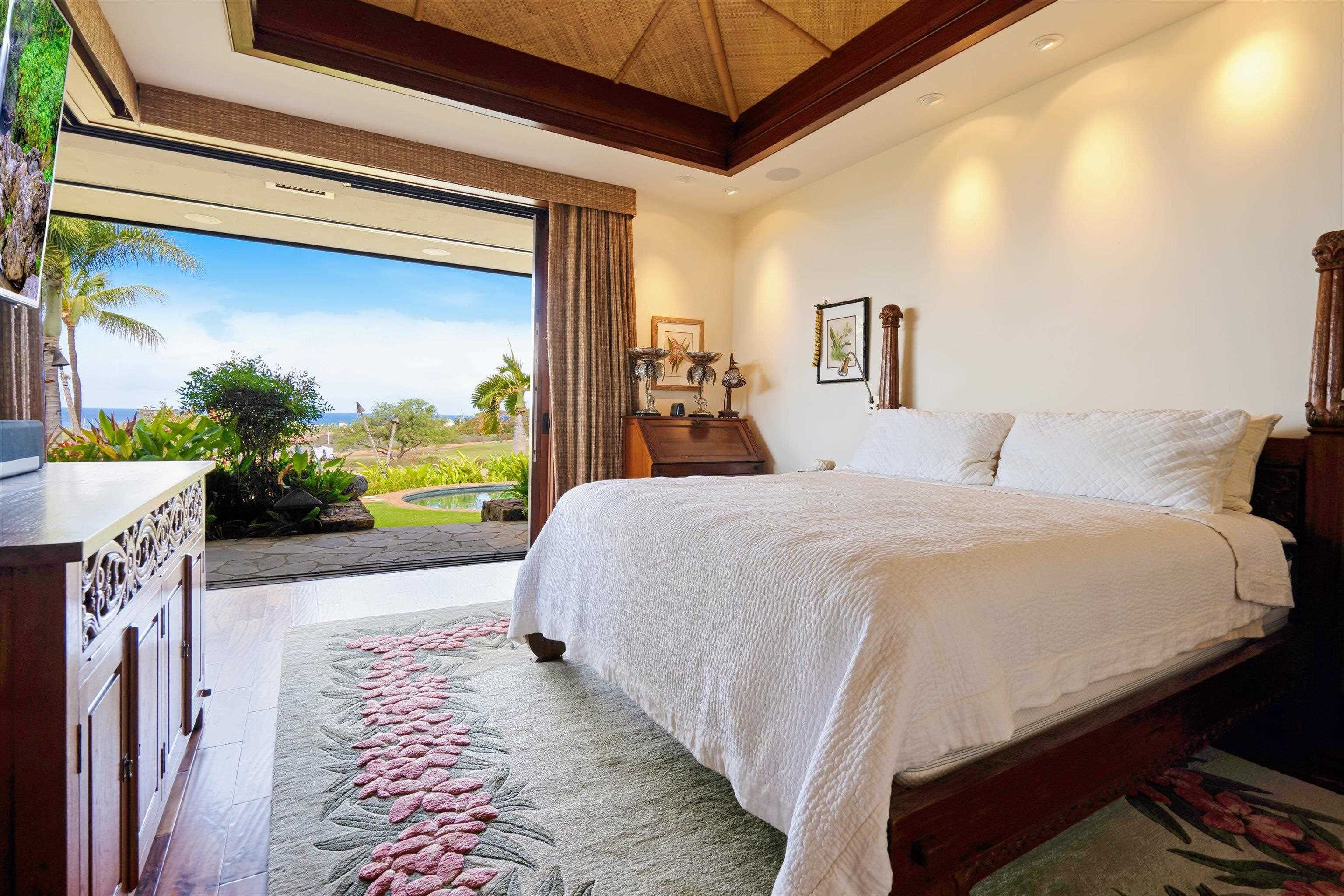 137 Anapuni Loop Lahaina, HI 96761 - Photo 29 of 47 a bed sitting in a bedroom next to a window