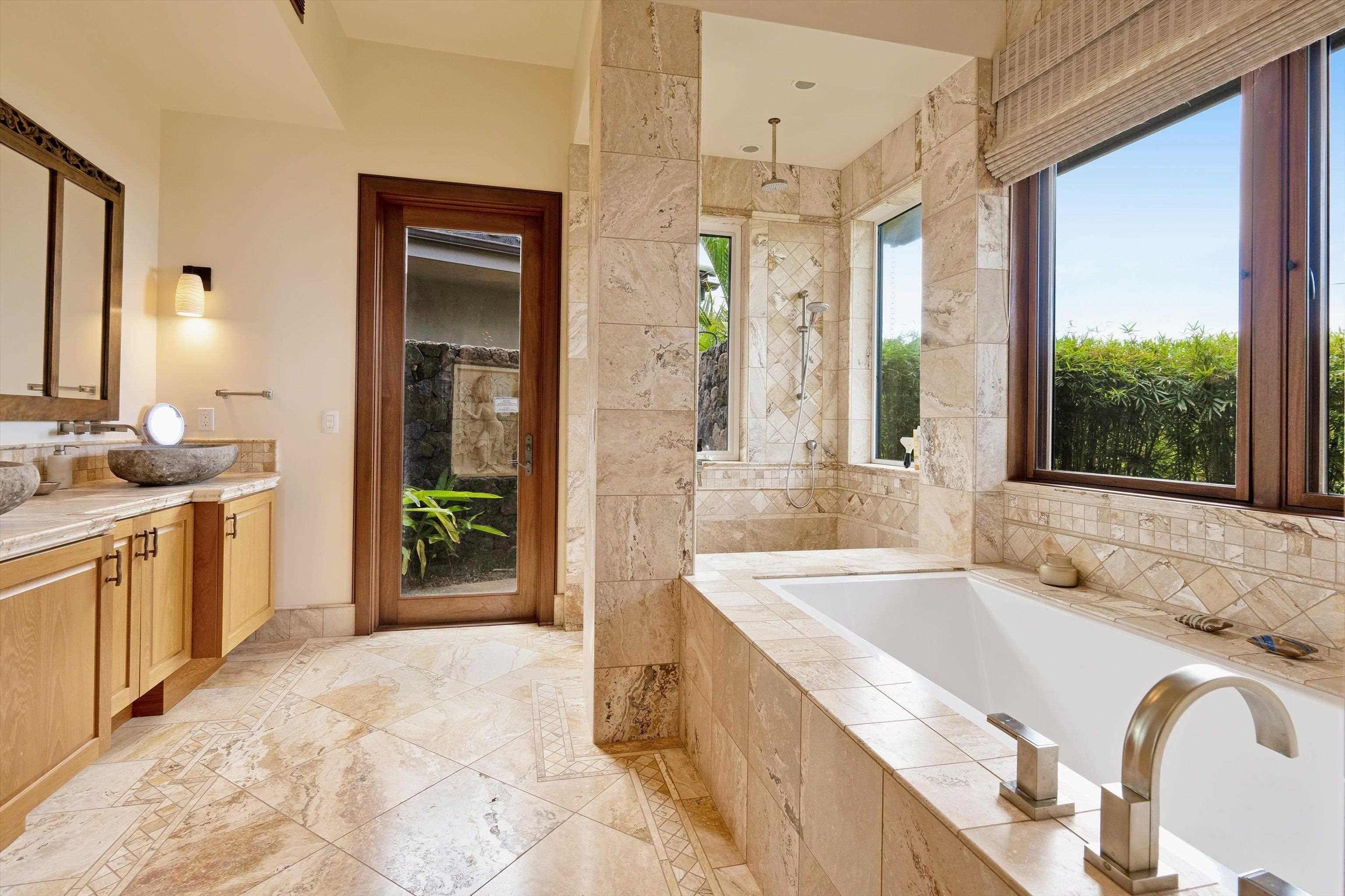 137 Anapuni Loop Lahaina, HI 96761 - Photo 30 of 47 a spacious bathroom with a granite countertop tub sink and mirror