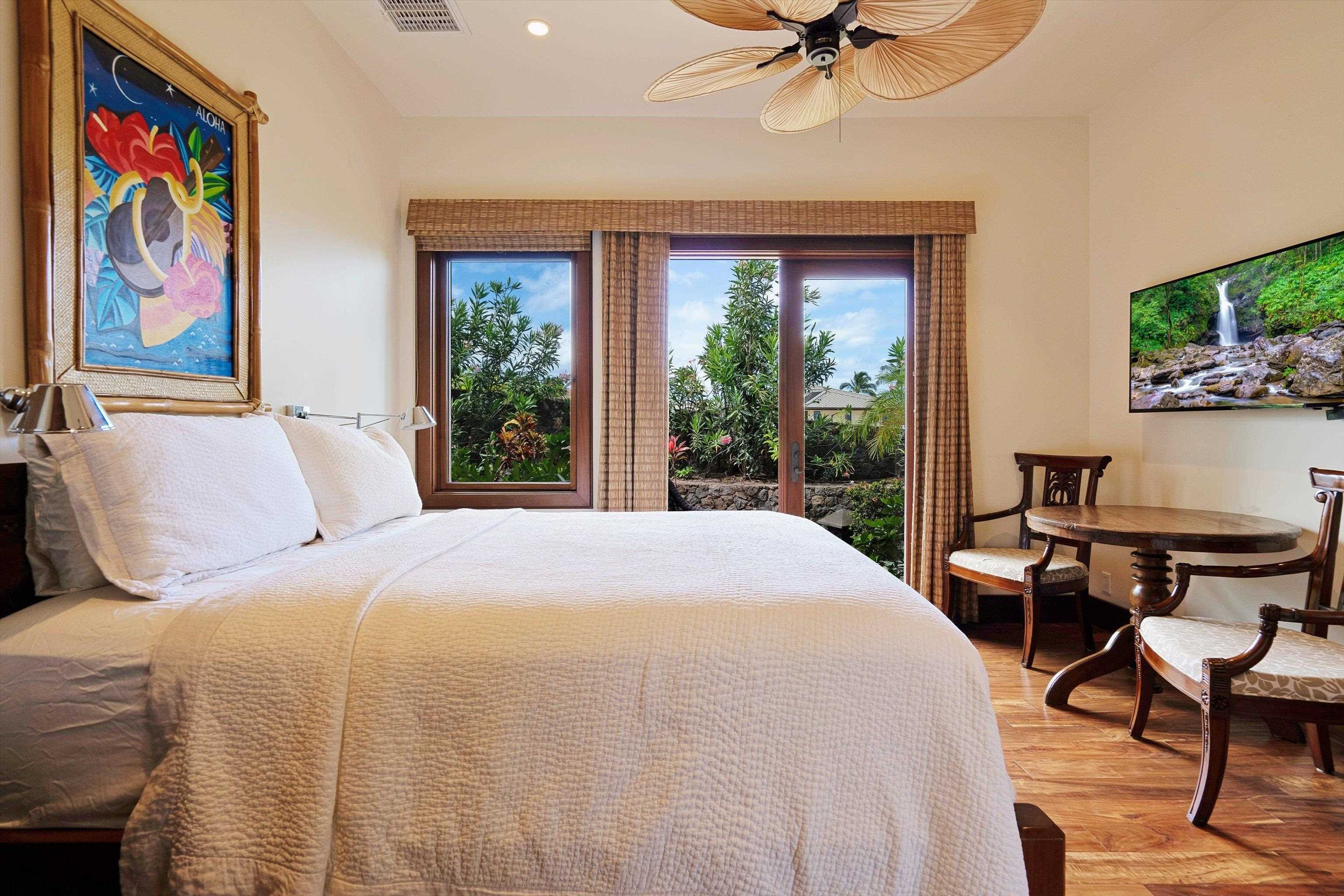 137 Anapuni Loop Lahaina, HI 96761 - Photo 35 of 47 a bedroom with a bed and a painting on the wall