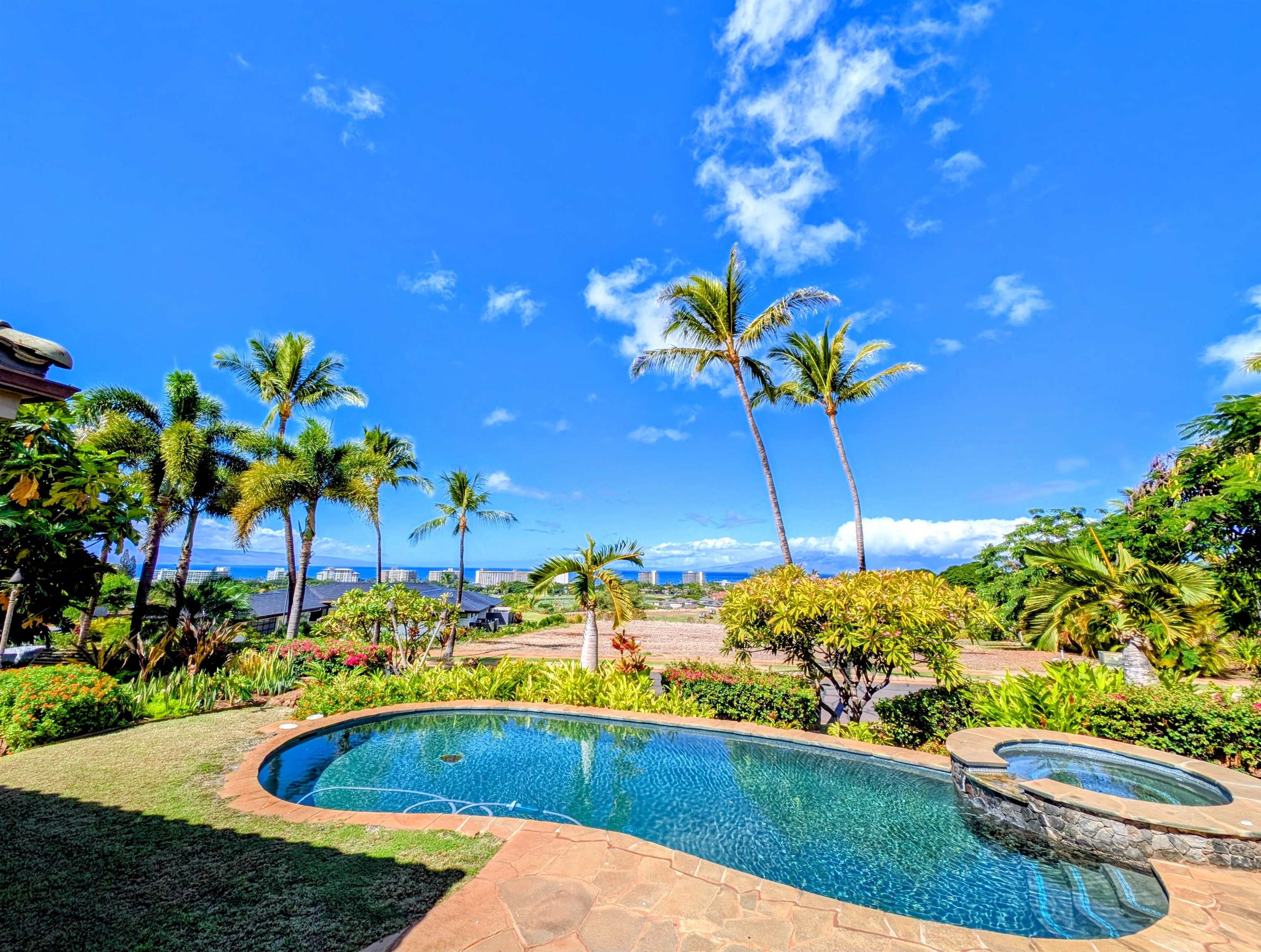 137 Anapuni Loop Lahaina, HI 96761 - Photo 4 of 47 a view of a swimming pool with a yard