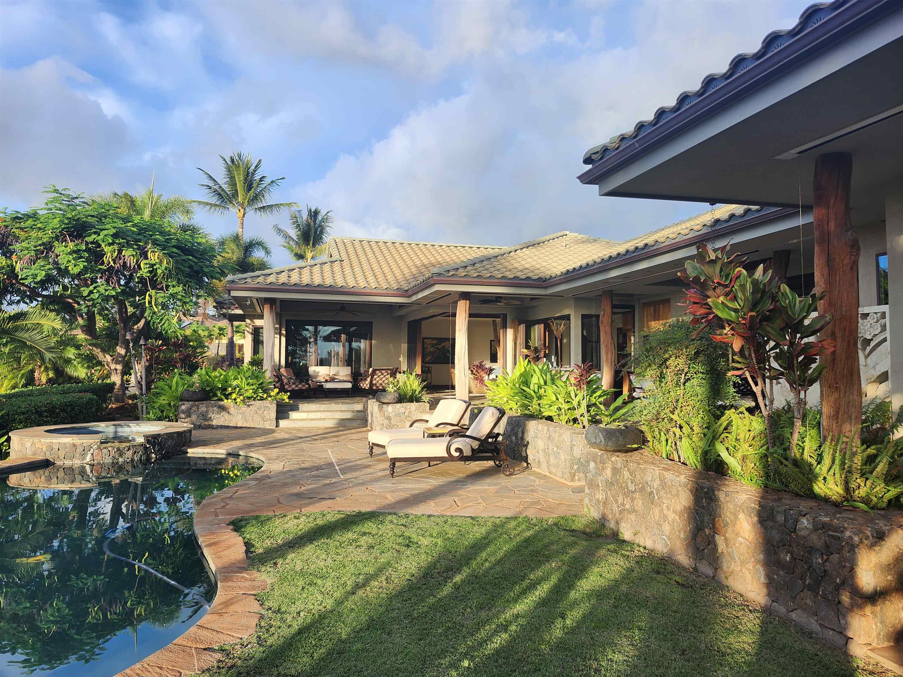 137 Anapuni Loop Lahaina, HI 96761 - Photo 42 of 47 a view of a house with patio outdoor seating area