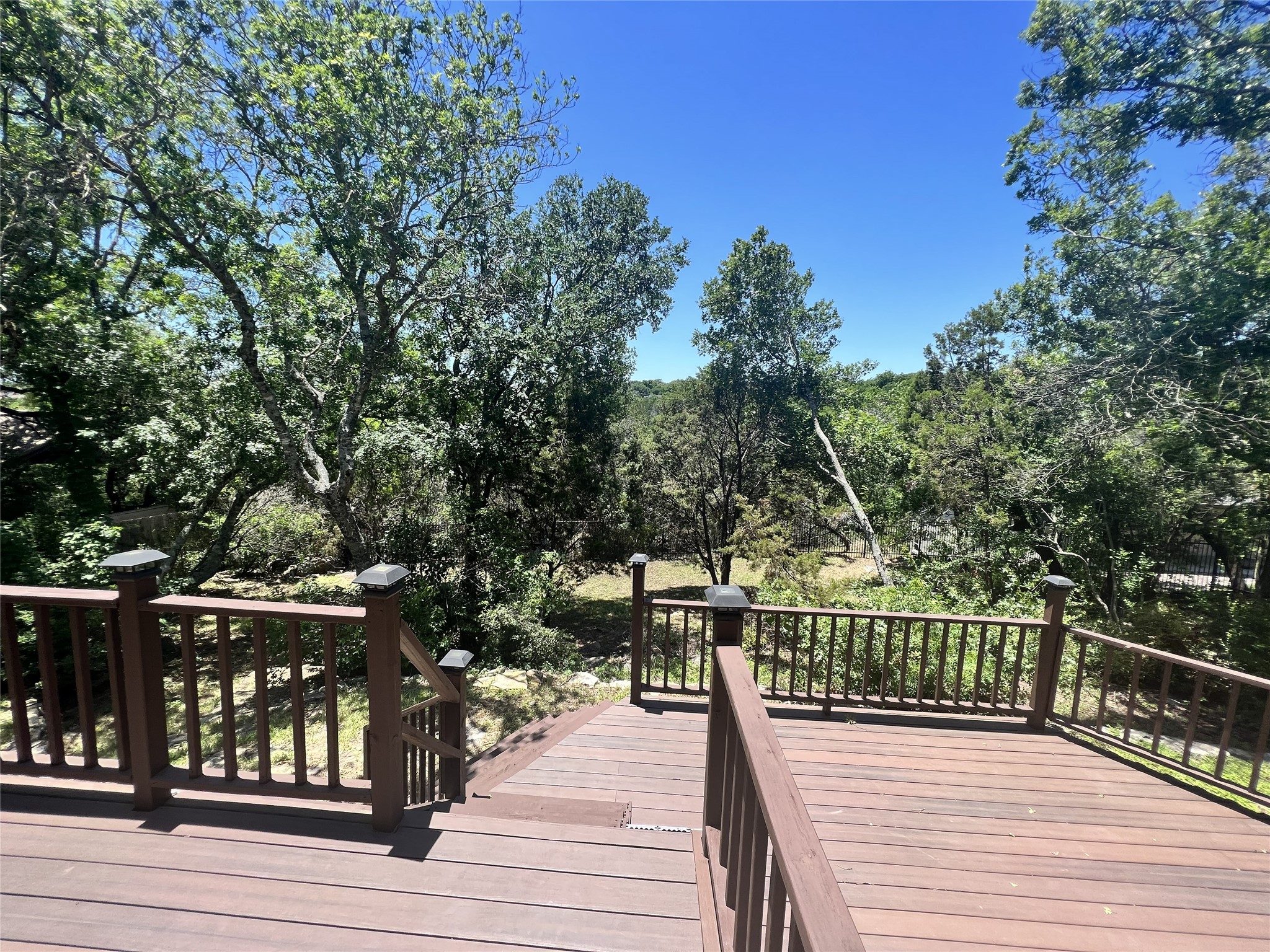 9405 Ashton Ridge Austin, TX 78750 - Photo 19 of 22 A spacious wooden deck provides tranquil views of the surrounding natural landscape.