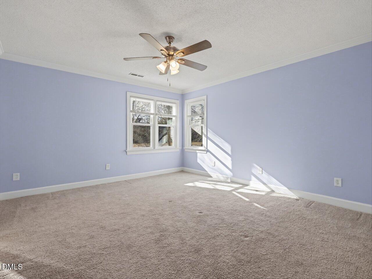4828 Forest Highland Drive Raleigh, NC 27604 - Photo 11 of 27 a view of a livingroom with a ceiling fan and window