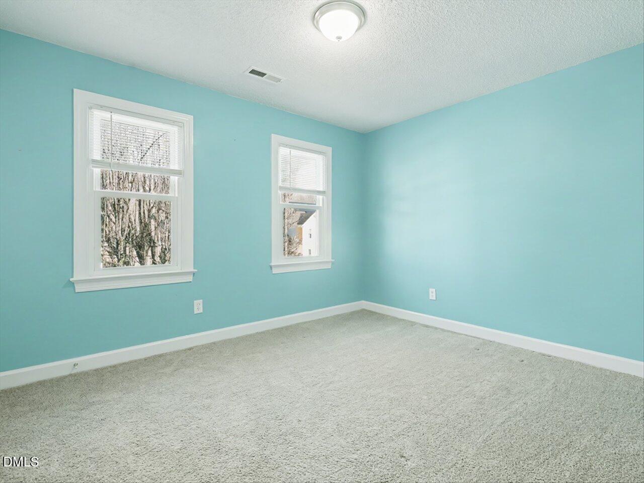 4828 Forest Highland Drive Raleigh, NC 27604 - Photo 14 of 27 an empty room with windows