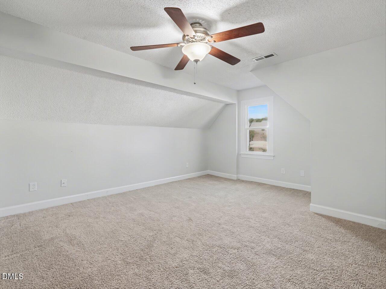 4828 Forest Highland Drive Raleigh, NC 27604 - Photo 16 of 27 an empty room with ceiling fan and windows