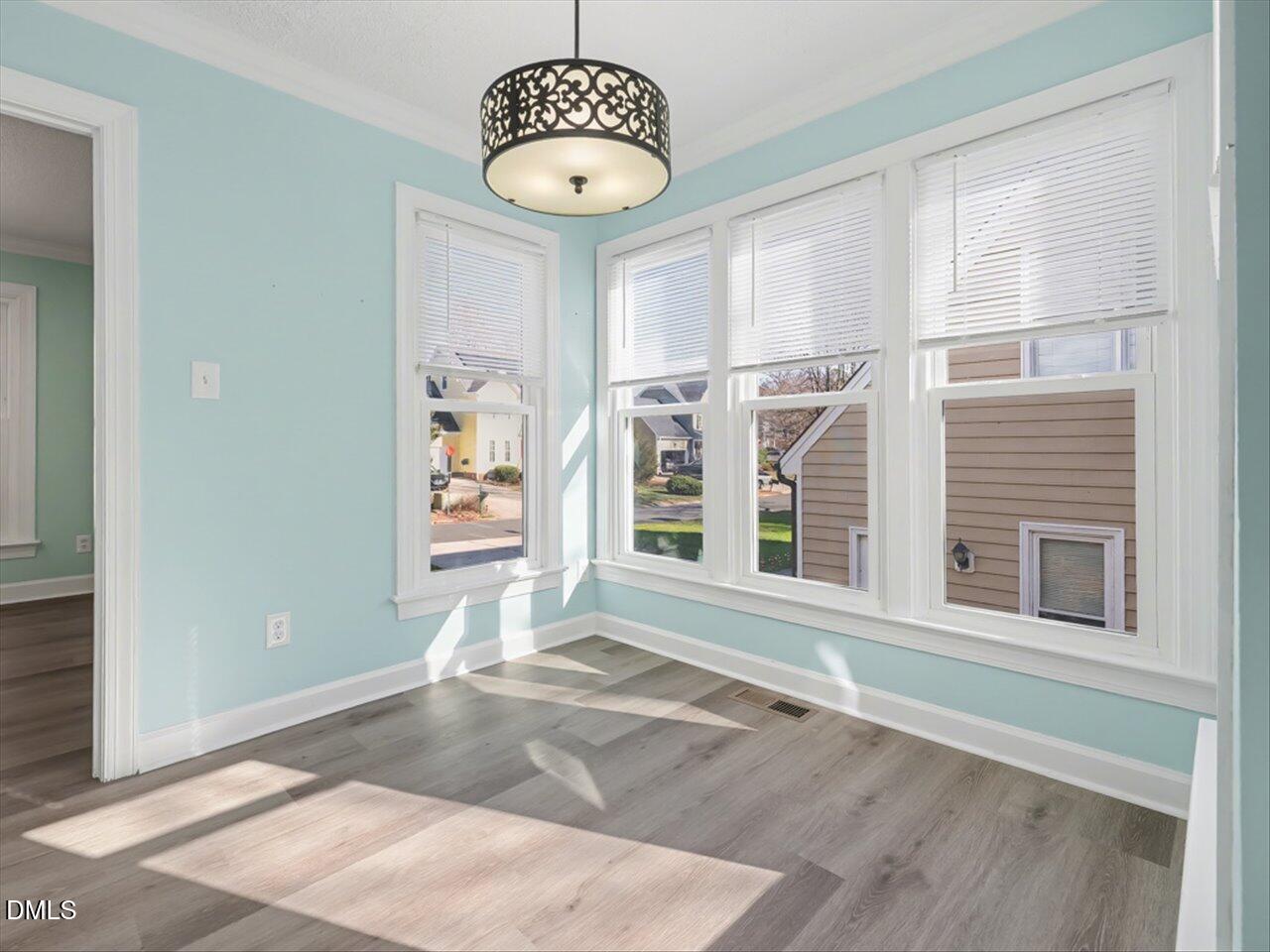 4828 Forest Highland Drive Raleigh, NC 27604 - Photo 6 of 27 a view of an empty room with a window