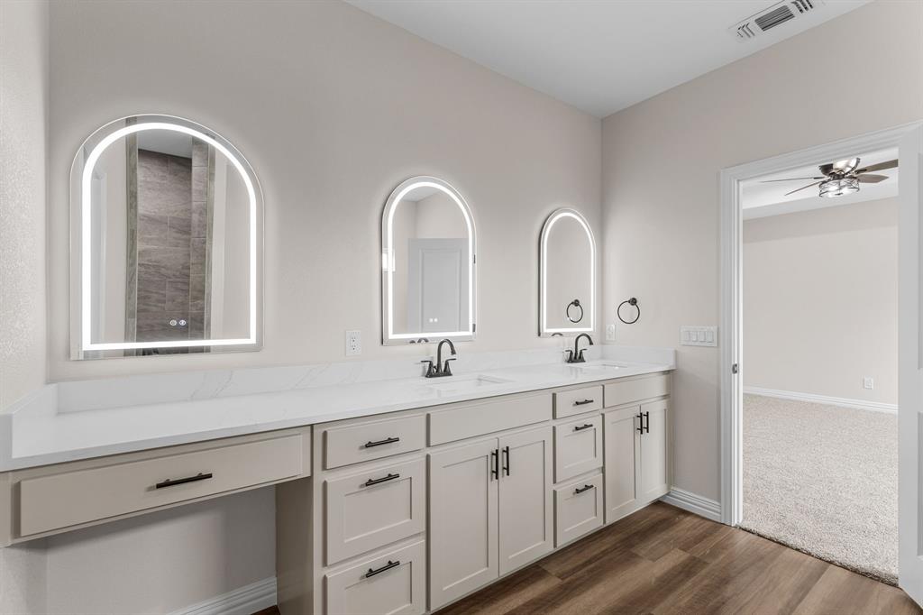 4695 Sisk Road Wichita Falls, TX 76310 - Photo 22 of 32 Bathroom with ceiling fan, vanity, and hardwood / wood-style floors