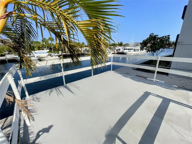 a view of staircase with white walls and windows