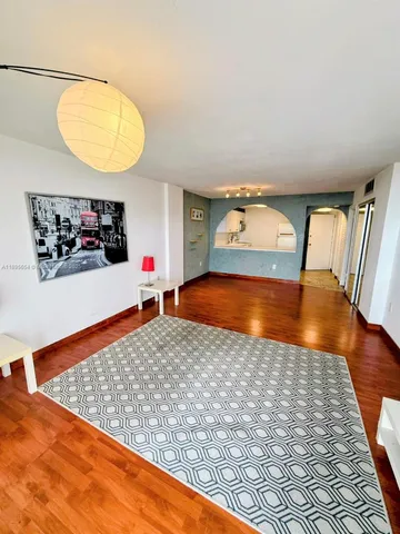 a view of a living room and bathroom