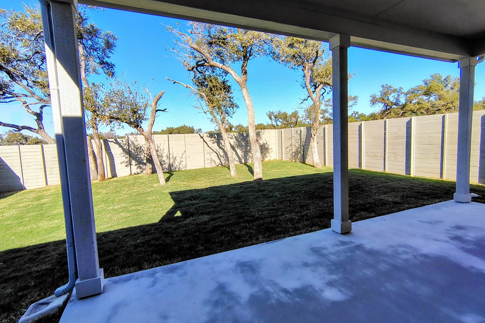 1804 Spg Mountain Cove Georgetown, TX 78628 - Photo 9 of 32 a view of a backyard of the house