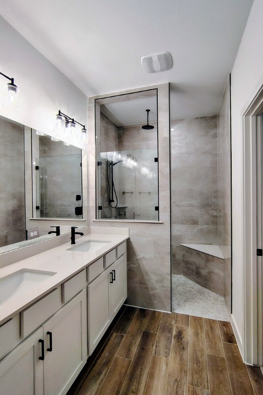 1804 Spg Mountain Cove Georgetown, TX 78628 - Photo 11 of 32 a bathroom with a double vanity sink and mirror