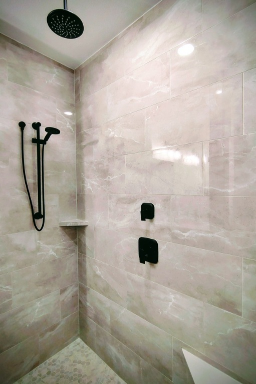 1804 Spg Mountain Cove Georgetown, TX 78628 - Photo 12 of 32 a bathroom with a shower