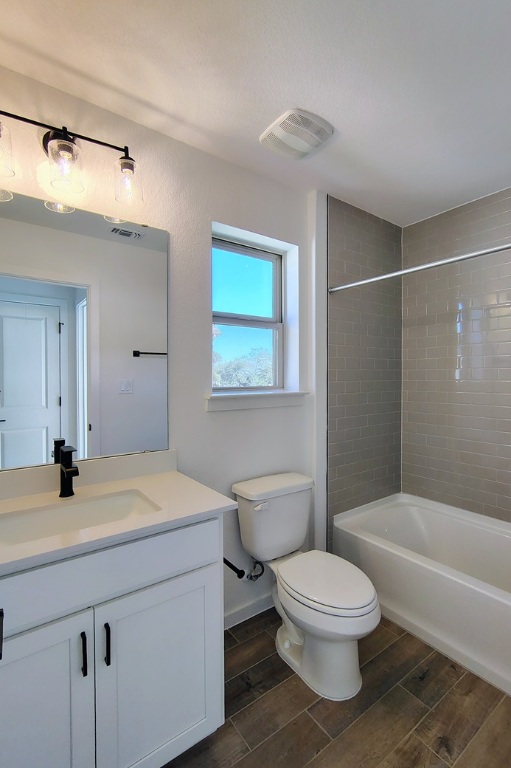 1804 Spg Mountain Cove Georgetown, TX 78628 - Photo 18 of 32 a bathroom with a sink a toilet and shower