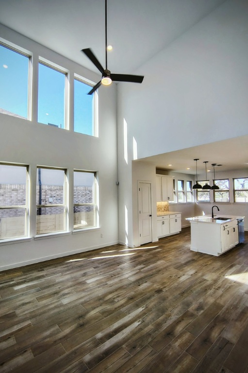 1804 Spg Mountain Cove Georgetown, TX 78628 - Photo 3 of 32 a view of an empty room with kitchen and window