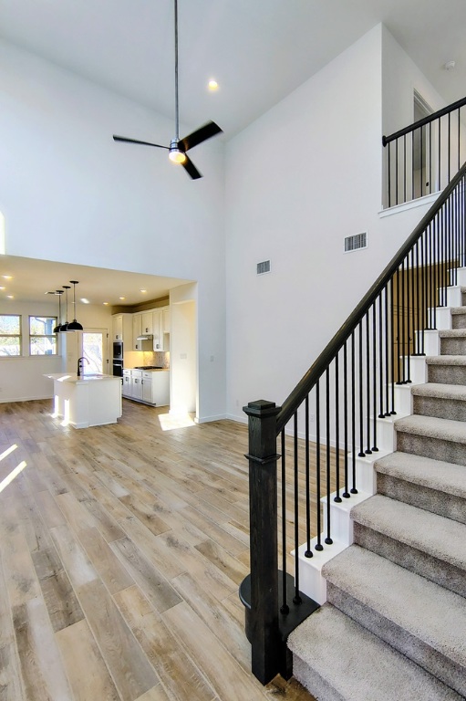 1804 Spg Mountain Cove Georgetown, TX 78628 - Photo 6 of 32 a view of a hallway with wooden floor and staircase