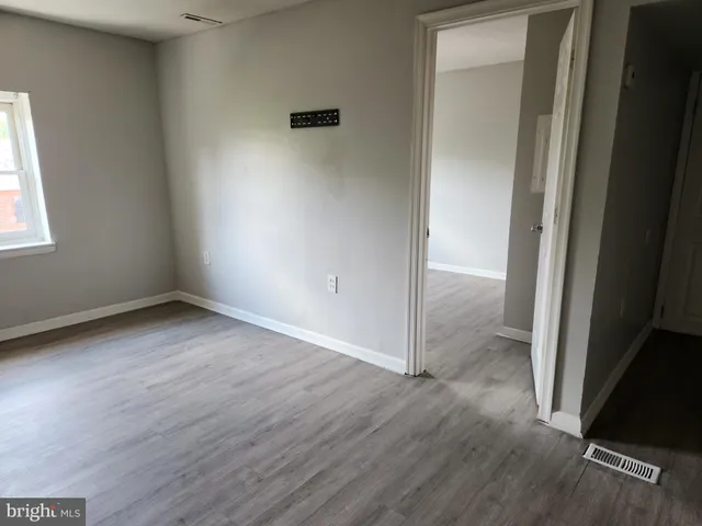 a bathroom with a sink toilet and a mirror