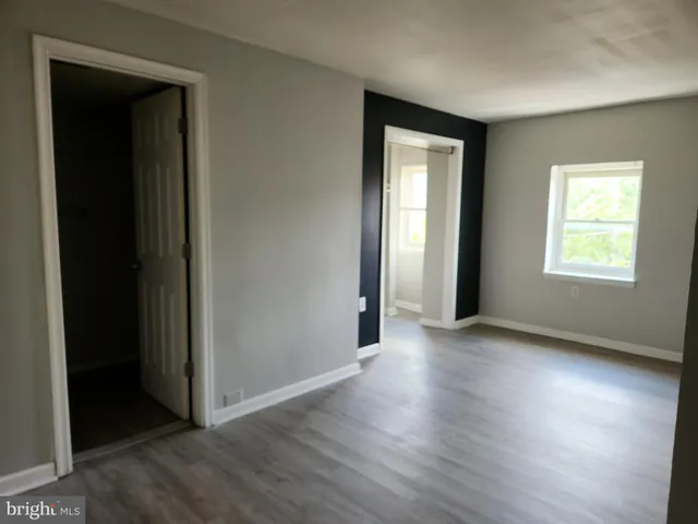 a kitchen with a sink a stove and cabinets