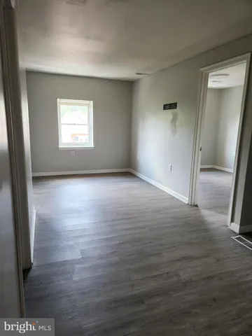 a kitchen with cabinets appliances and a sink