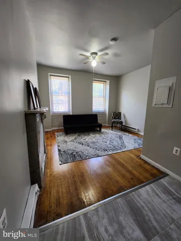 a bedroom with a bed and a dresser in it