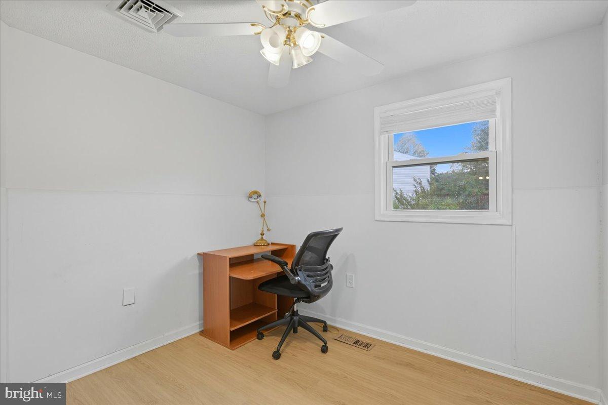 619 Aspen Lane Edgewood, MD 21040 - Photo 18 of 35 a workspace with wooden floor and a window