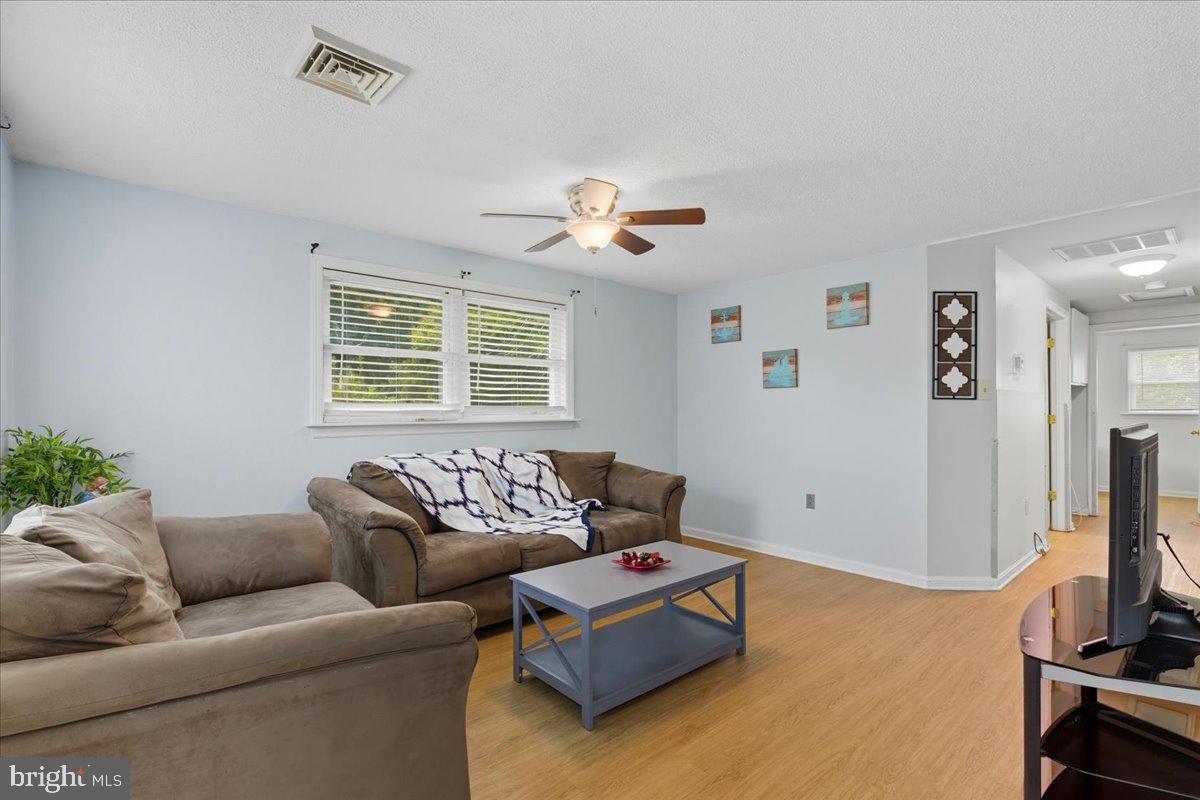 619 Aspen Lane Edgewood, MD 21040 - Photo 7 of 35 a living room with furniture and a flat screen tv