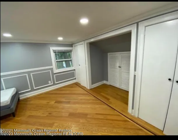 a bathroom with a sink a toilet a mirror and shower