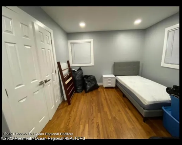 a backyard of a house with lots of green space and a fountain