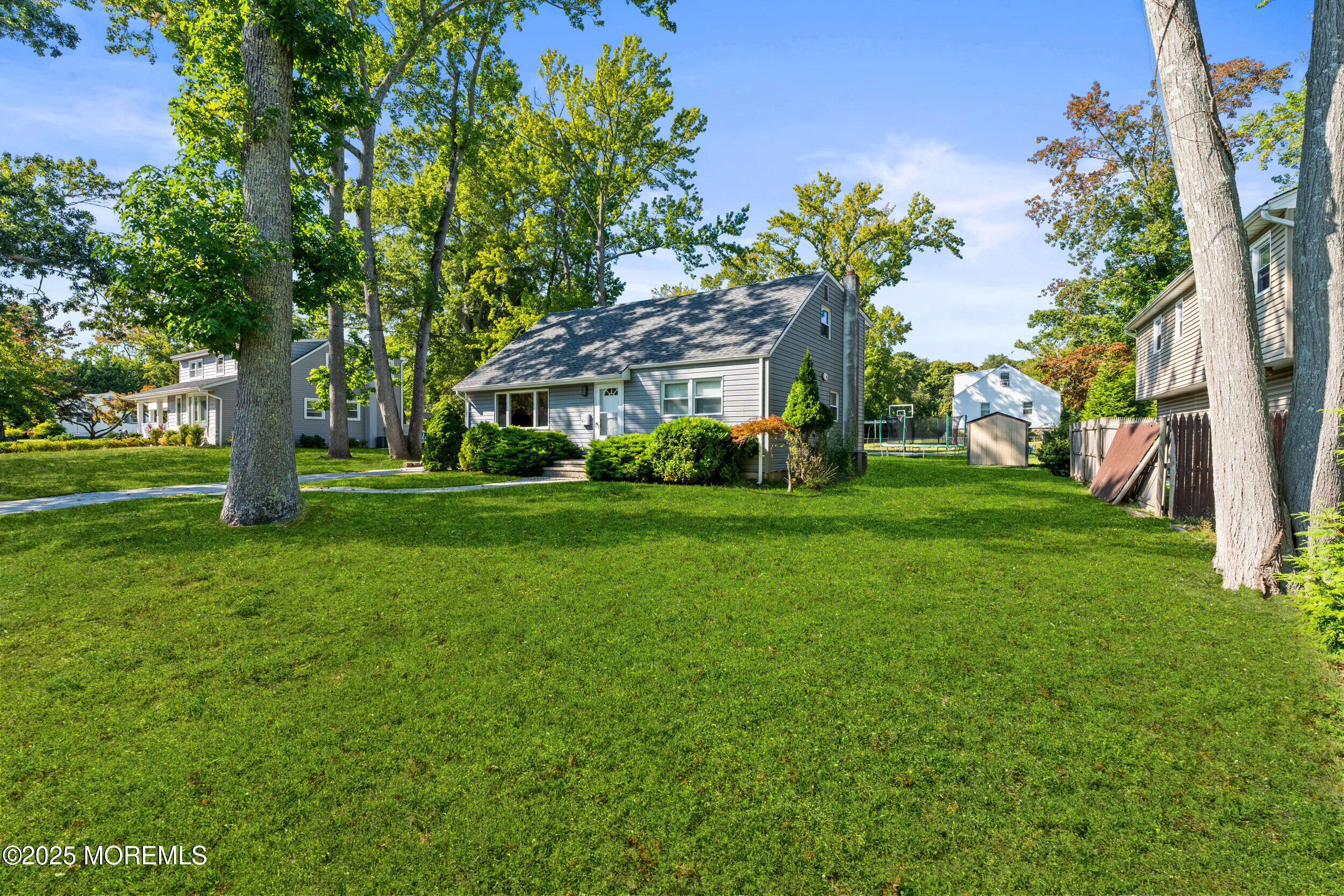 437 Redmond Avenue Oakhurst, NJ 07755 - Photo 22 of 26 a front view of a house with garden