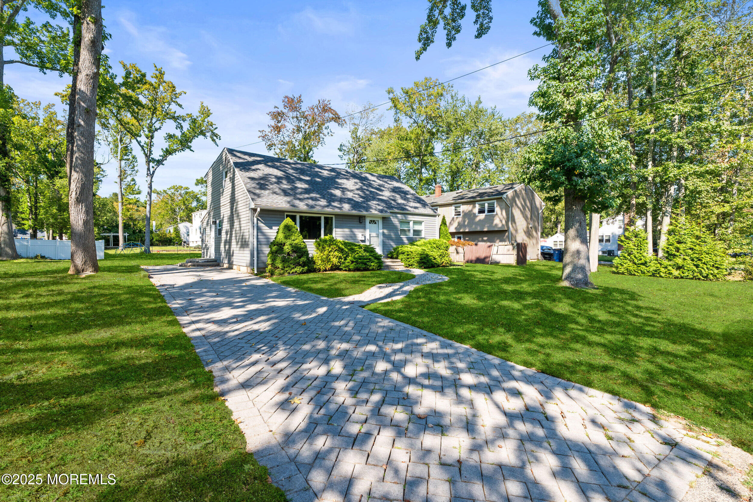 437 Redmond Avenue Oakhurst, NJ 07755 - Photo 23 of 26 a front view of a house with a yard