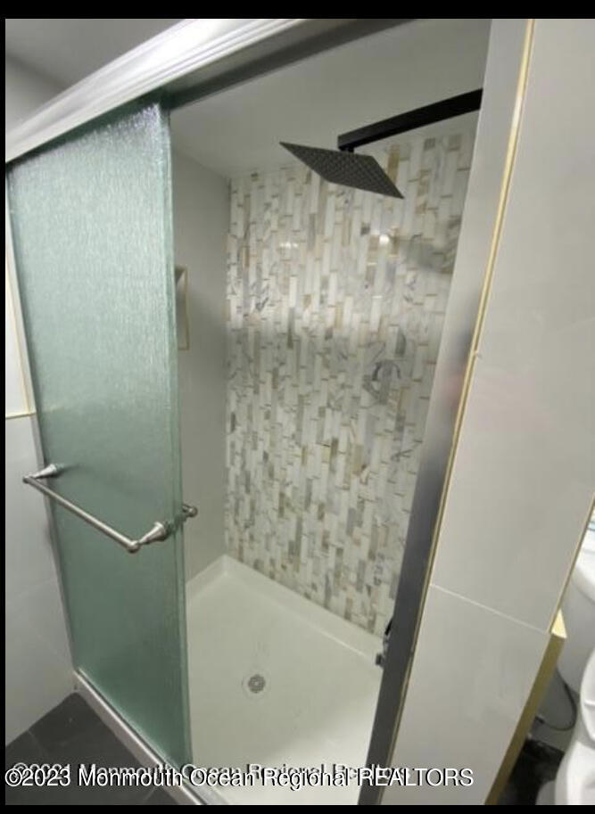 437 Redmond Avenue Oakhurst, NJ 07755 - Photo 10 of 26 a bathroom with a shower