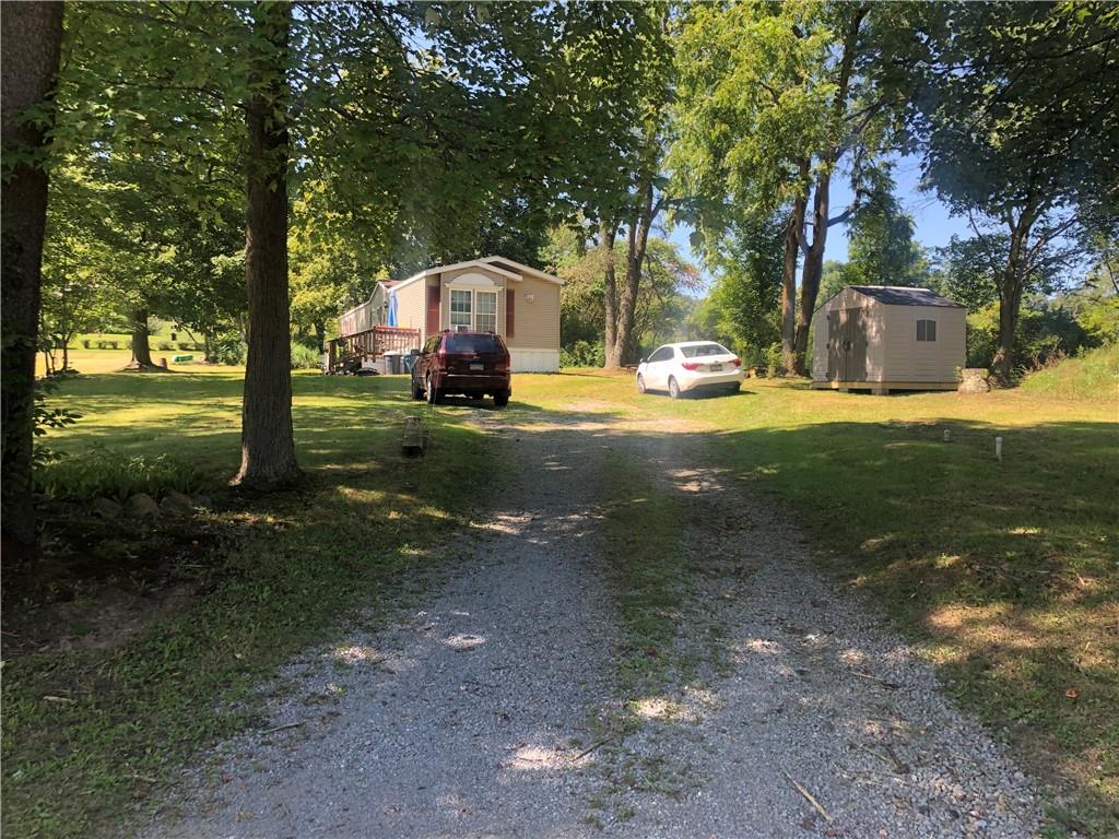 106 Boozel Road Slippery Rock, PA 16057 - Photo 8 of 19 Driveway to the lot owner rents to the mobile home owner.
