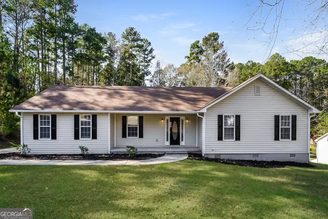 a house view with a outdoor seating space