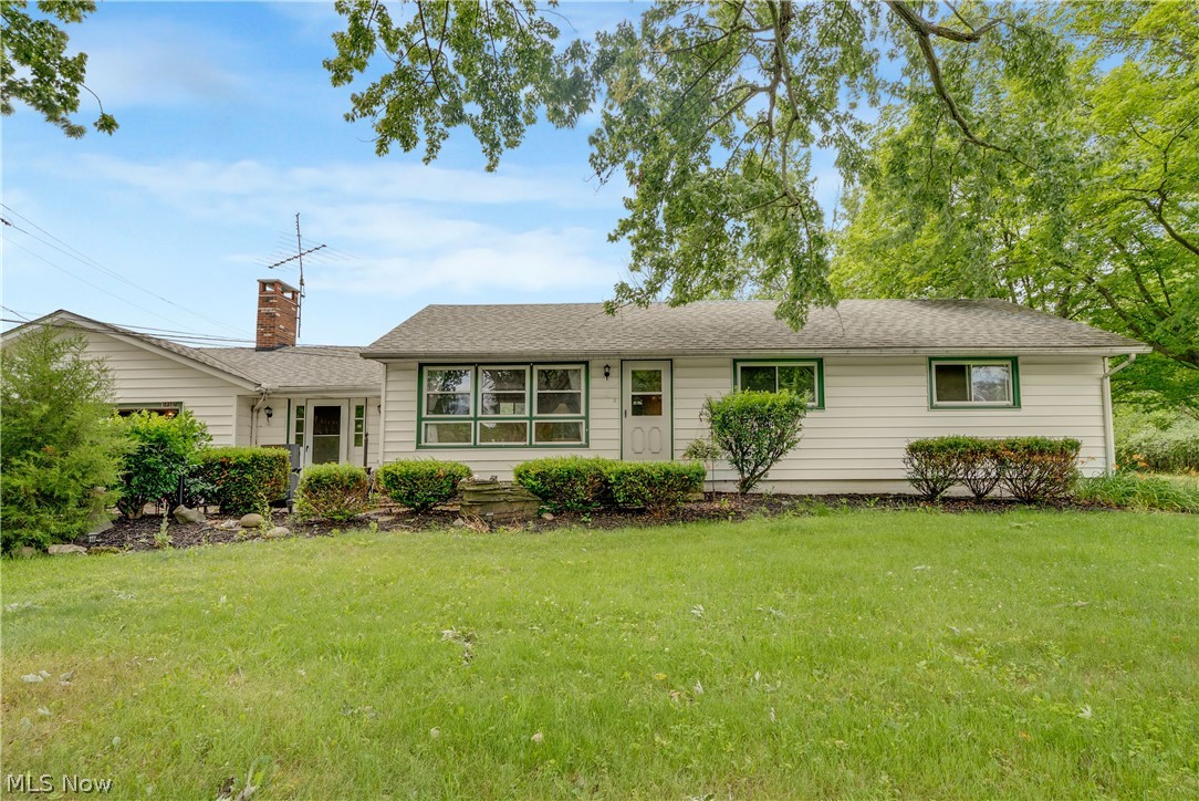 16107 Moseley Road Madison, OH 44057 - Photo 6 of 40 Ranch-style exterior with white siding and green trim